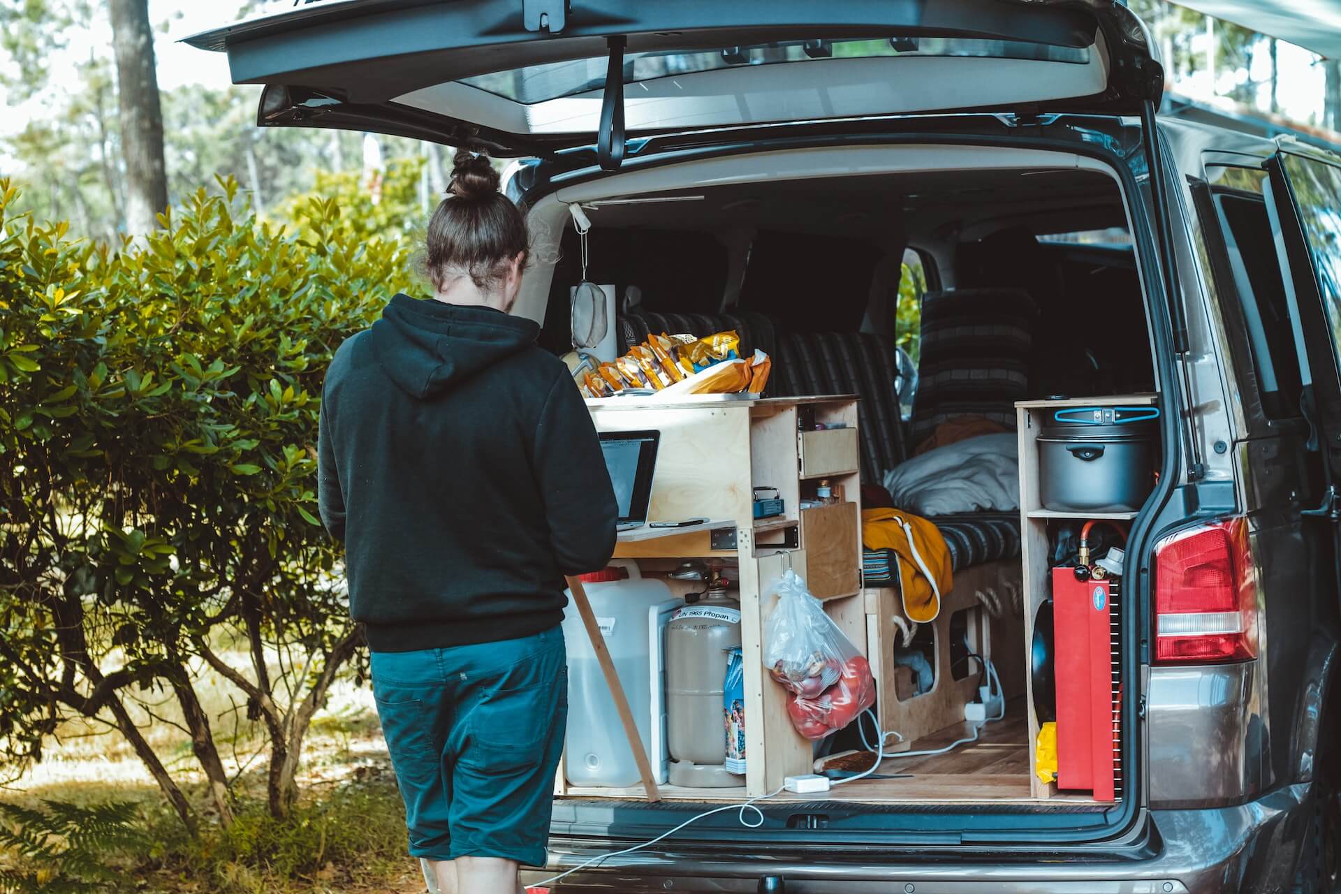 Nomad working on his car camping setup